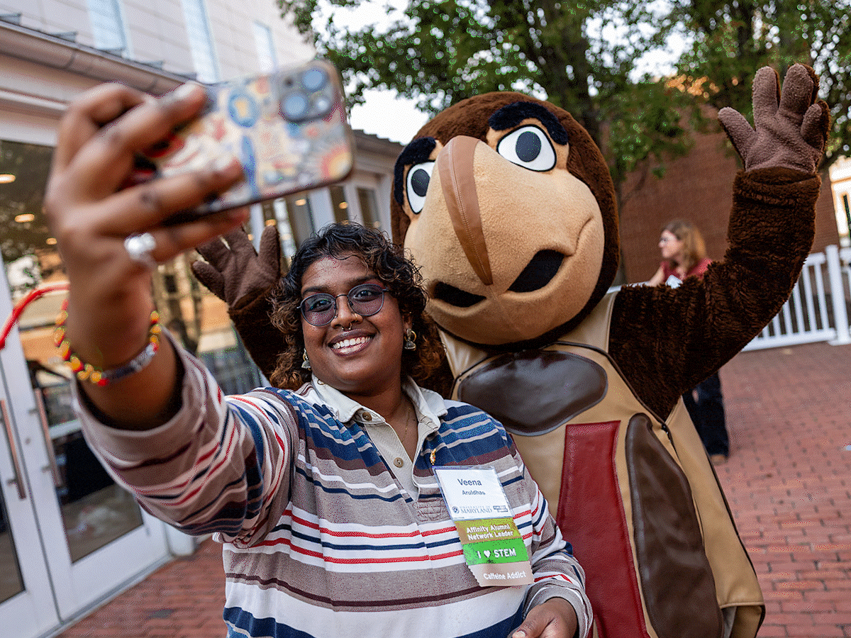 Testudo, the University of Maryland Terrapin mascot, poses with various attendees at the 2026 Volunteer Summit event at the Riggs Alumni Center on campus.